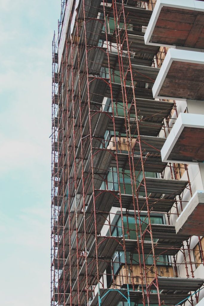 High-rise building in Berlin under construction with visible scaffolding.